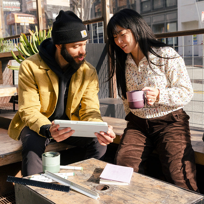 12oz-rise-mug-r3 12oz_rise_coffee_mug_dusty_orchid_couple_city_patio_square.jpg