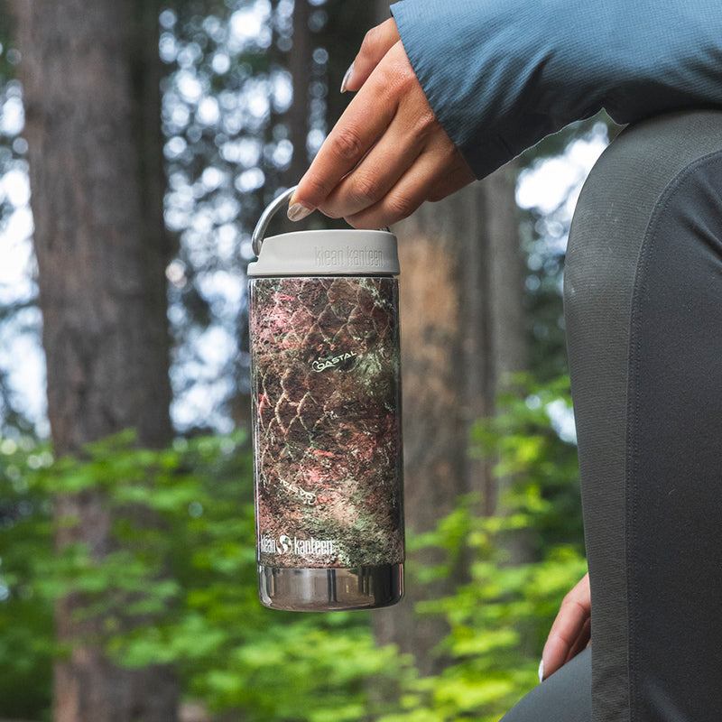 12oz-tkwide-with-twist-cap-mossy-oak-k6 12oz_tumbler_mossyoak_rainbowtrout_hand_closeup_square.jpg