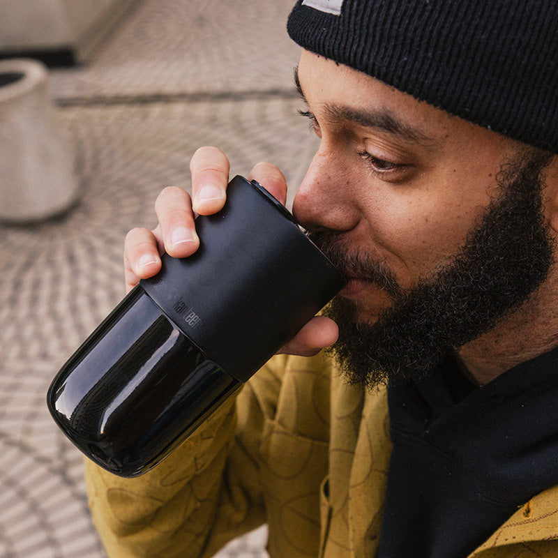 16oz-rise-tumbler-o7 16oz_rise_tumbler_black_man_drink_square.jpg