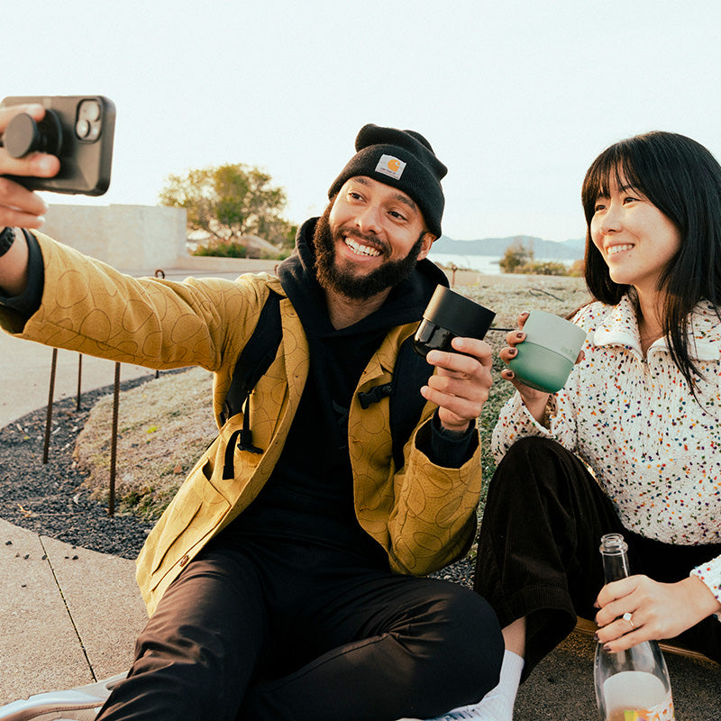 bring-your-own-party-kit-tumblers-and-cocktails-a8 8oz_rise_lowball_black_iceberg_couple_selfie_city_square.jpg