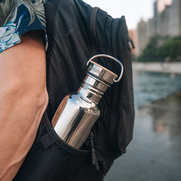 27oz-reflect-with-bamboo-cap-o3 K27SSLRF-MS-BAMBOO_reflect-bottle_backpack_lifestyle.jpg